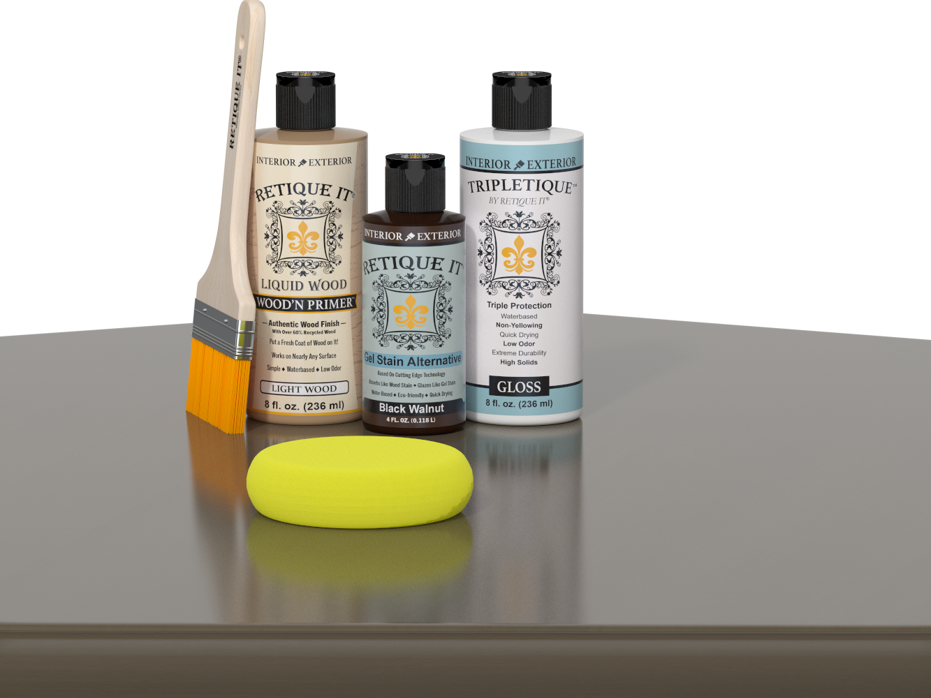 Retique It Black Walnut Kit with Gloss Tripletique, Light Wood Wood'n Primer, Black Walnut Gel Stain Alternative, paintbrush, and yellow sponge on a tabletop.