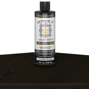 Retique It Liquid Wood Wood'n Stain in Classic Black, 8 oz bottle, showcasing the dark stain applied to wood surface.