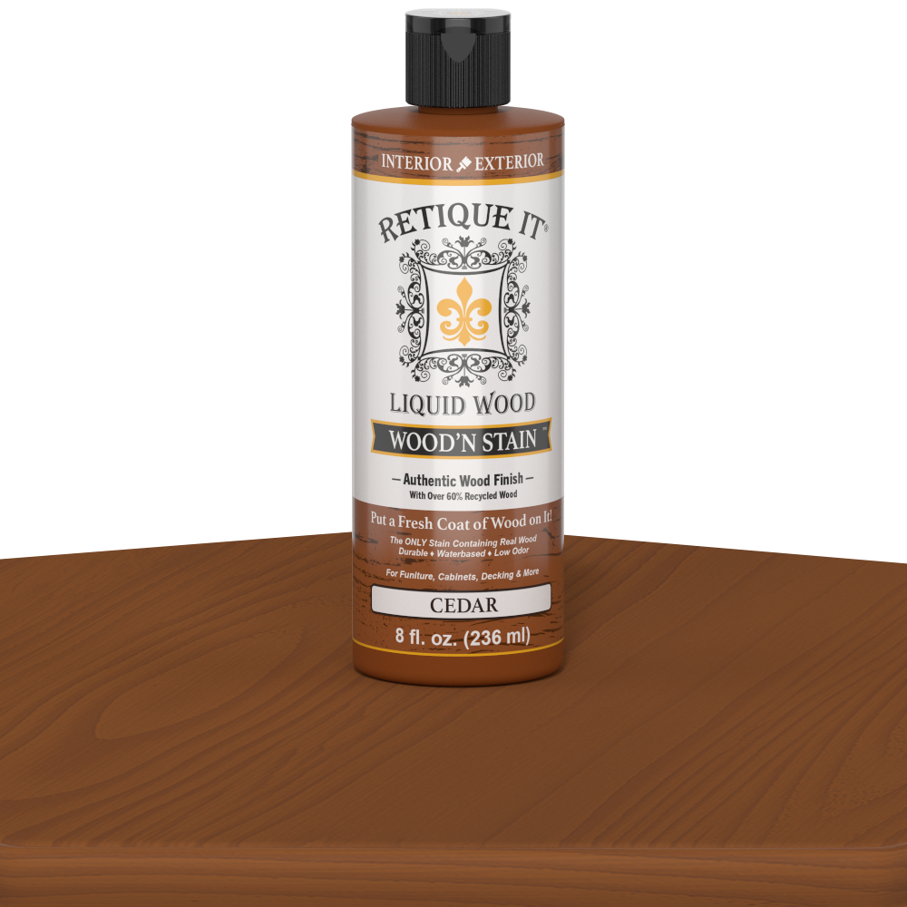 Retique It Liquid Wood Wood'n Stain in Cedar color, 8 oz bottle showing the stain's warm cedar wood finish.