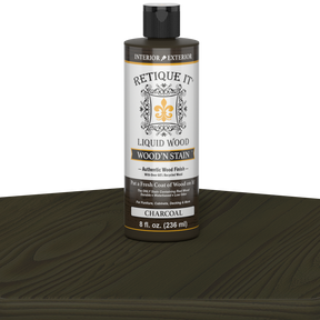 Retique It Liquid Wood Wood'n Stain in 8 oz Charcoal, showcasing the dark, rich stain applied to wood for a deep charcoal finish.