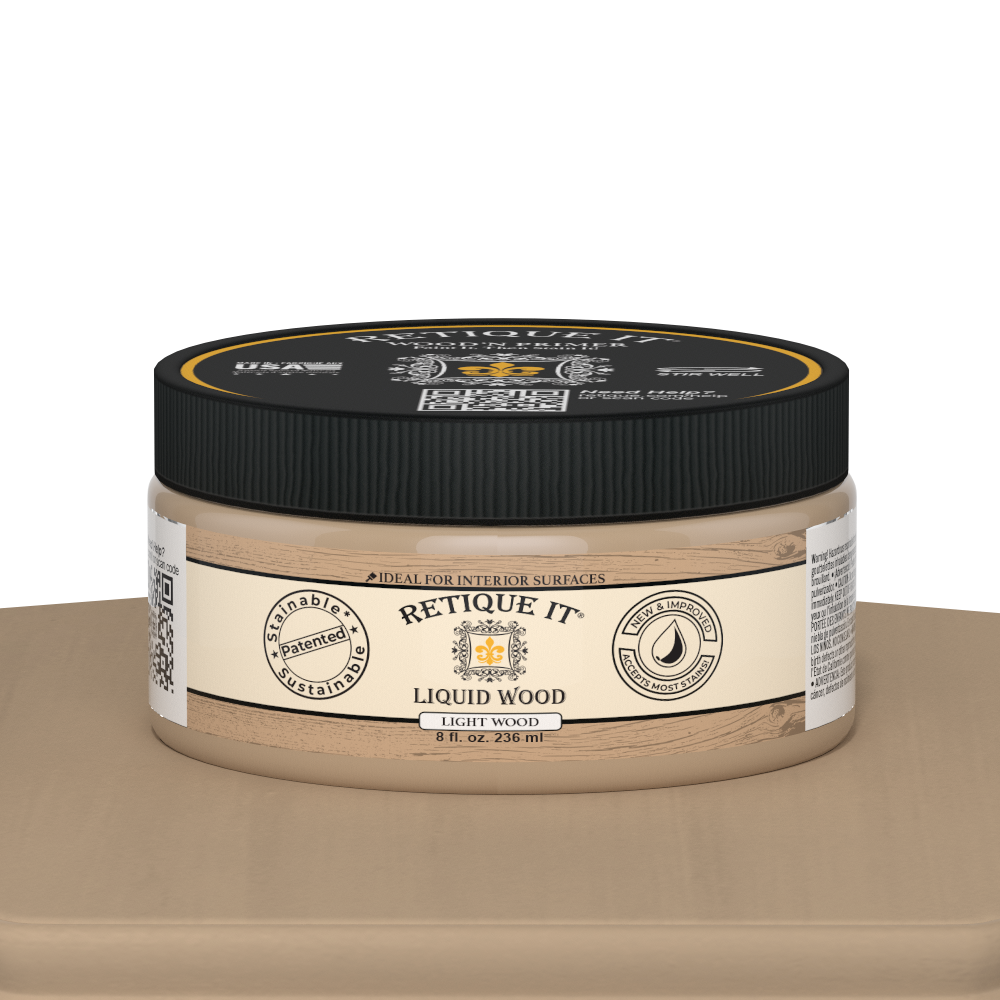 Retique It® Liquid Wood paint jar in light interior finish, 8oz size, displayed on a table with a natural wood-looking appearance.