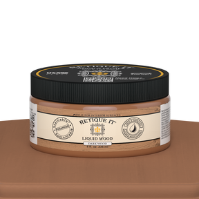 Dark liquid wood paint by Retique It® in an 8oz jar, shown on a table, ideal for interior wood finishing projects.