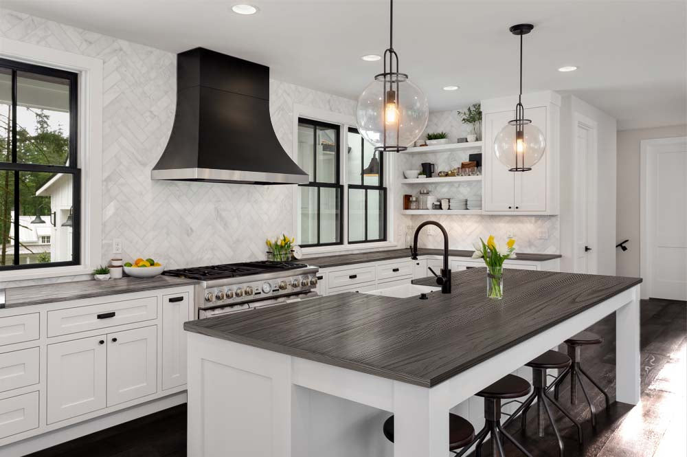 Retique It® Harbor Gray countertop kit with wood grain stain applied to a kitchen countertop, showcasing a modern gray finish.