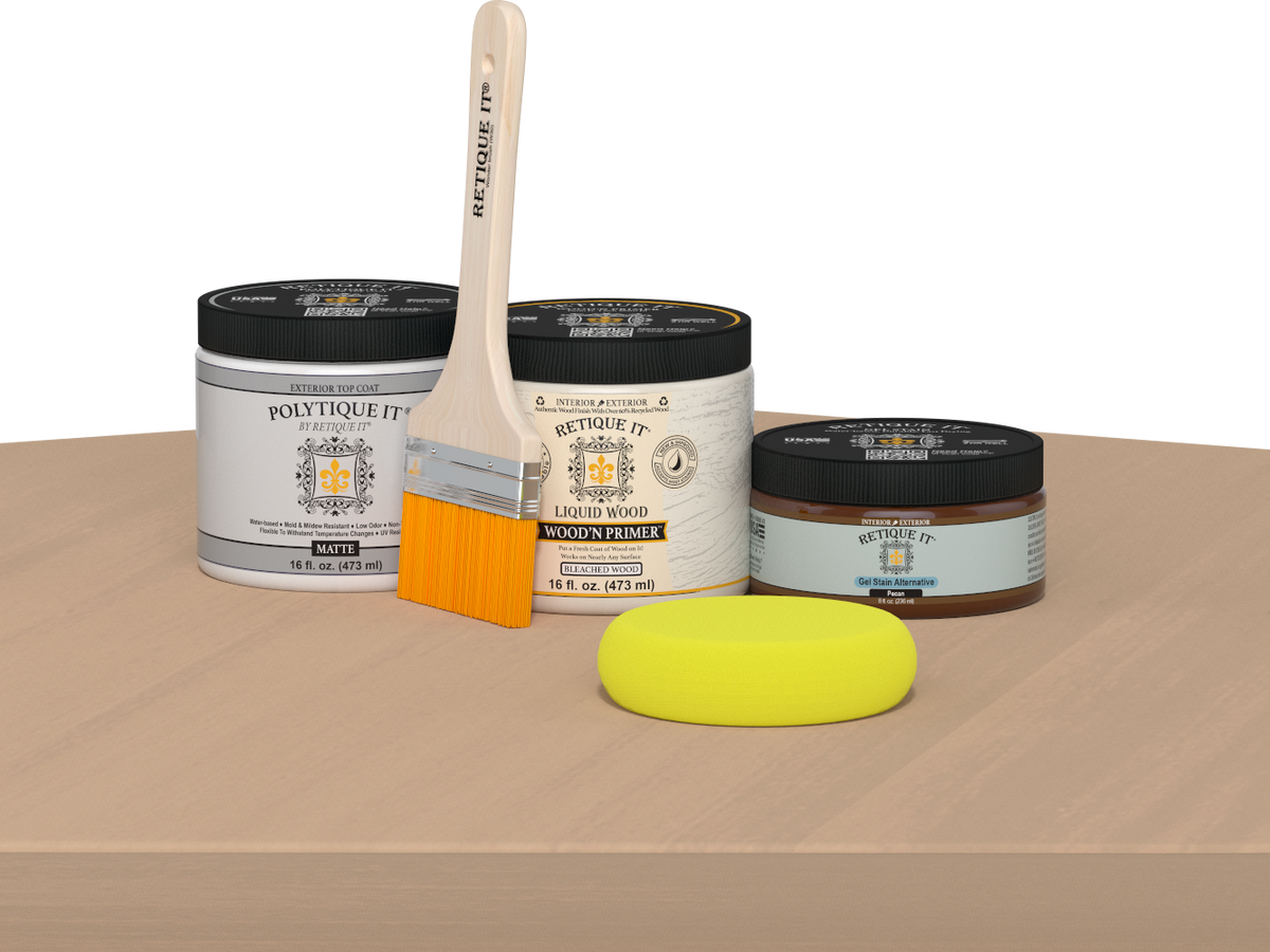 Retique It® Pecan Multipurpose Kit contents with Bleached Wood Liquid Wood primer, Pecan gel stain alternative, PolyTique It® matte exterior top coat, paintbrush, and yellow sponge displayed on a light wood surface.