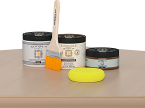 Retique It® White Oak Multipurpose Kit contents with Liquid Wood primer, Pecan gel stain alternative, satin exterior top coat, paintbrush, and yellow sponge displayed on a light wood surface.