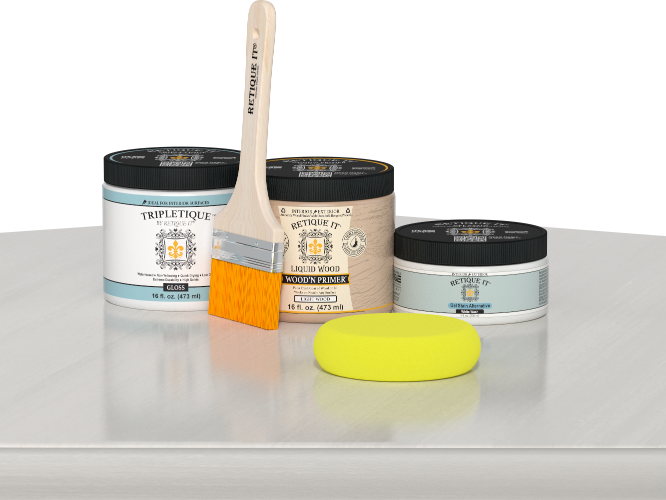 Retique It® White Wash Multipurpose Kit contents with Liquid Wood primer, White Wash gel stain alternative, Tripletique gloss interior top coat, paintbrush, and yellow sponge displayed on a white wood surface.