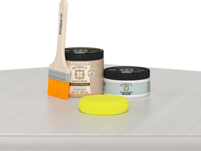 Retique It® White Wash Multipurpose Kit contents with Liquid Wood primer, White Wash gel stain alternative, paintbrush, and yellow sponge displayed on a white wood surface.