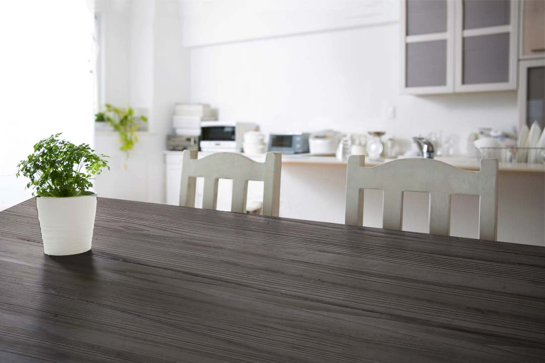 Retique It Wood'n Kit Harbor Gray interior top coat applied to a wooden tabletop with a textured grain finish.
