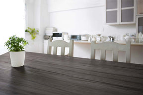 Retique It Wood'n Finish Kit in Harbor Gray for wood furniture, showing a grained tabletop with wood finish application.