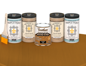 64 oz Retique It Liquid Wood kit with Golden Oak stain, matte Tripletique topcoat, and a paintbrush on a matching finished tabletop.