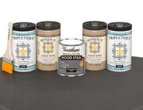 64 oz Retique It Liquid Wood kit with Weathered Gray stain, satin Tripletique topcoat, and a paintbrush on a matching finished tabletop.
