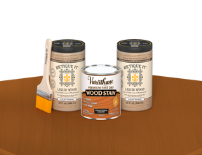 64 oz Retique It Liquid Wood kit with Varathane Traditional Cherry stain and a paintbrush on a matching finished tabletop.