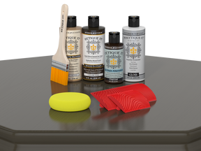 Retique It® Wood'n Finish Kit in charcoal for exterior wood surfaces, showing a table with the kit's top coat and application tools.