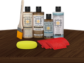 Retique It® Wood'n Finish Kit in Dark Oak stain showing a tabletop with dark oak wood finish and application tools.