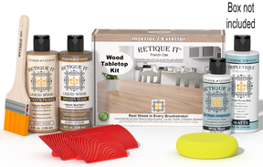 Retique It® French Oak Wood Tabletop Kit with Light Wood primer, Barn Wood stain, White Wash gel stain alternative, Matte Tripletique® Top Coat, brush, red graining tool, yellow sponge, and product box.