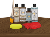 Retique It® Medium Walnut Wood'n Kit with Light Wood primer, Barn Wood stain, Pecan gel stain alternative, Matte Tripletique® Top Coat, brush, red graining tool, and yellow sponge.