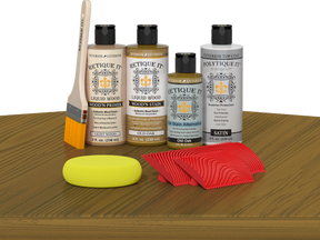 Retique ItÂ® Wood'n Finish Kit in Old Oak, exterior top coat, showing the multi-purpose kit with wood finish components on a table.