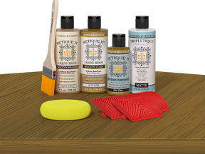 Retique It® Wood'n Finish Kit in Old Oak stain displayed on a table, showing the stain application for wood finishing.