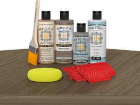 Retique It® Weathered Wood Wood'n Kit with Light Wood primer, Weathered Wood stain, Weathered Wood gel stain alternative, Satin Tripletique® Top Coat, brush, red graining tool, and yellow sponge.