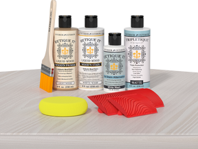 Retique It® Wood'n Finish Kit in White Wash stain applied to a tabletop, showcasing the wood finish and color.