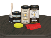 Retique It Wood'n Finish front door kit in charcoal stain, showing a double wooden door with stained finish on a table.
