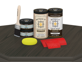 Retique It Wood'n Finish front door kit in charcoal stain, showing a double wooden door with stained finish on a table.