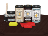 Retique It Wood'n Finish Kit with four large red mahogany stain bottles and matte finish on a tabletop surface.