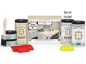Retique It® white wash countertop kit with stains, featuring a full kitchen setup and a box of supplies.