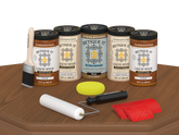 Retique It® Wood'n Cabinet Kit with 24 cedar-grained stain doors displayed on a table for kitchen cabinet renovation.