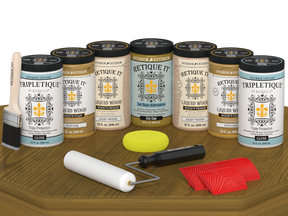 Retique It® Wood'n Cabinet Kit in Old Oak stain, showing glossy finish on a cabinet door with wood grain texture.