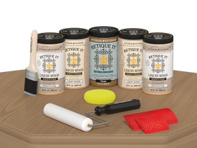 Retique It Pickled Oak Kit with Liquid Wood, Pecan Gel Stain Alternative, yellow sponge, red graining tool, roller, and brush.