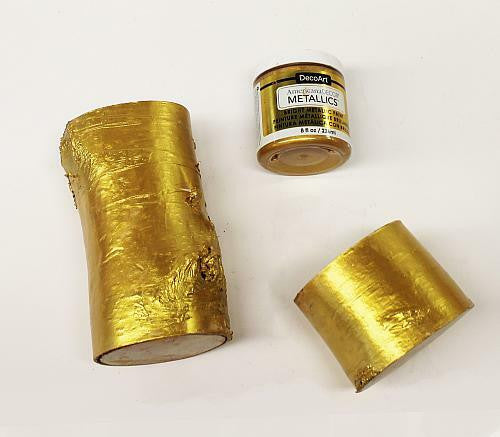DecoArt Metallics 24K Gold paint set with three bottles of shimmering gold acrylic paint for crafts and artistic projects.
