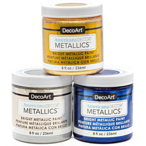 Decorative metallic paint set with three colors from DecoArt, featuring vibrant, shimmering finishes in small bottles.