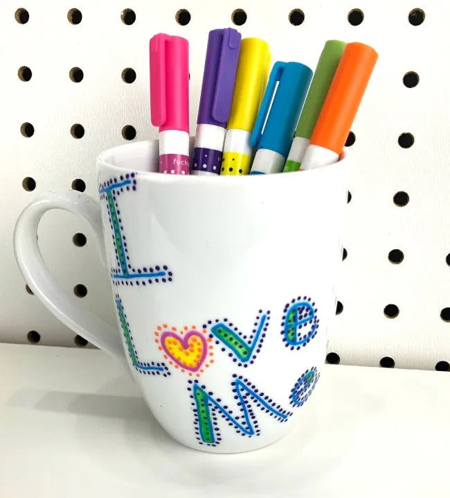 DecoArt glass paint marker set with six colorful markers for decorating glass surfaces and creating vibrant designs.