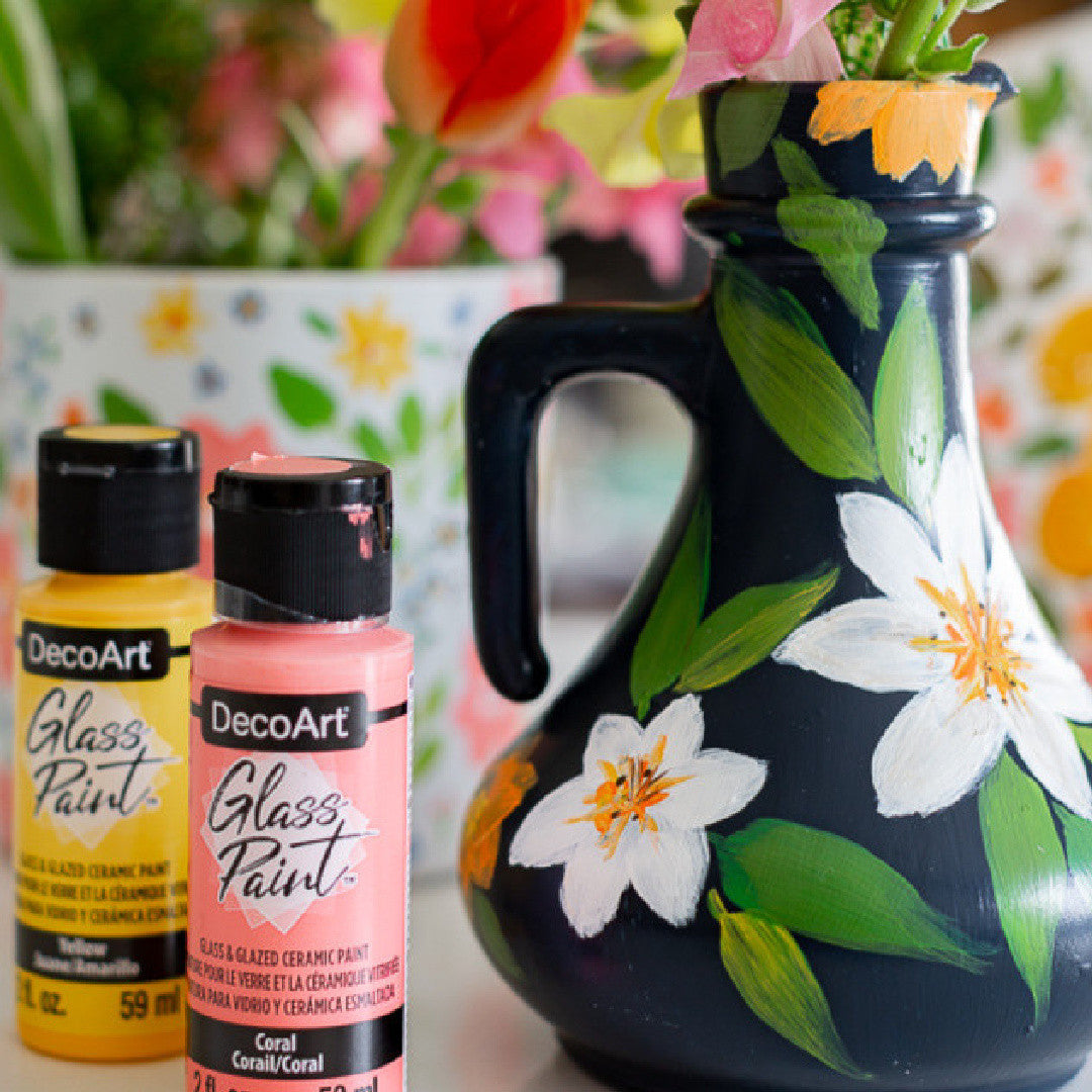 White DecoArt Glass Paint in 2 oz bottle, showcasing smooth application and vibrant finish on glass surfaces.