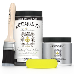 Retique It® furniture and cabinet paint in Greystone, quart size, showing a smooth, finished wood surface in a stylish gray hue.