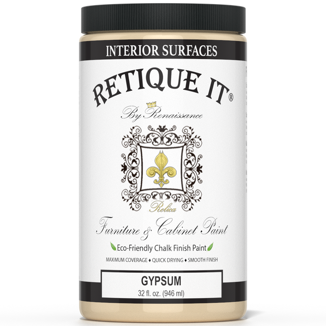 Retique It furniture and cabinet paint quart in gypsum color, shown on a wooden surface with a brush and paint can.