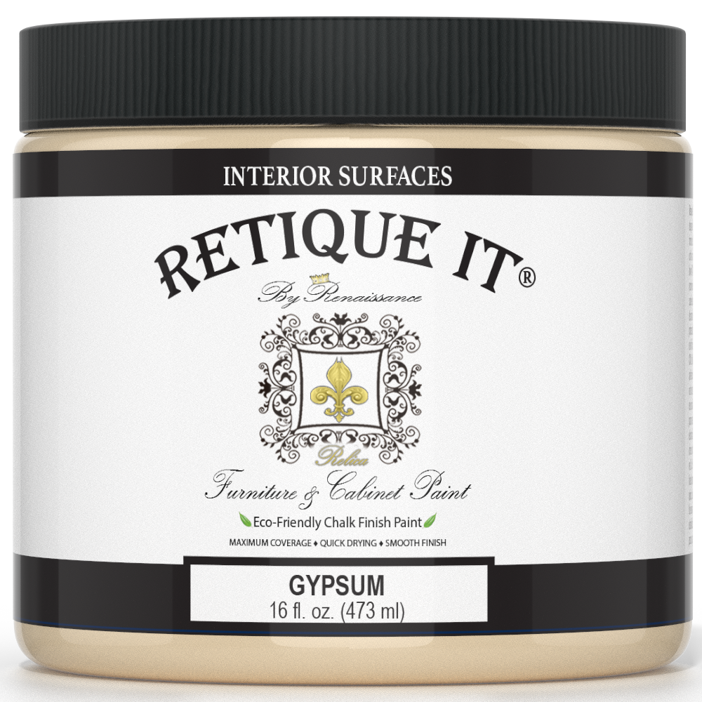 Retique It® furniture and cabinet paint in a quart container, designed for gypsum surfaces, shown in a natural setting.
