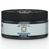 Retique It Classic Black gel stain applied on wood surface, showcasing deep black color and smooth finish.
